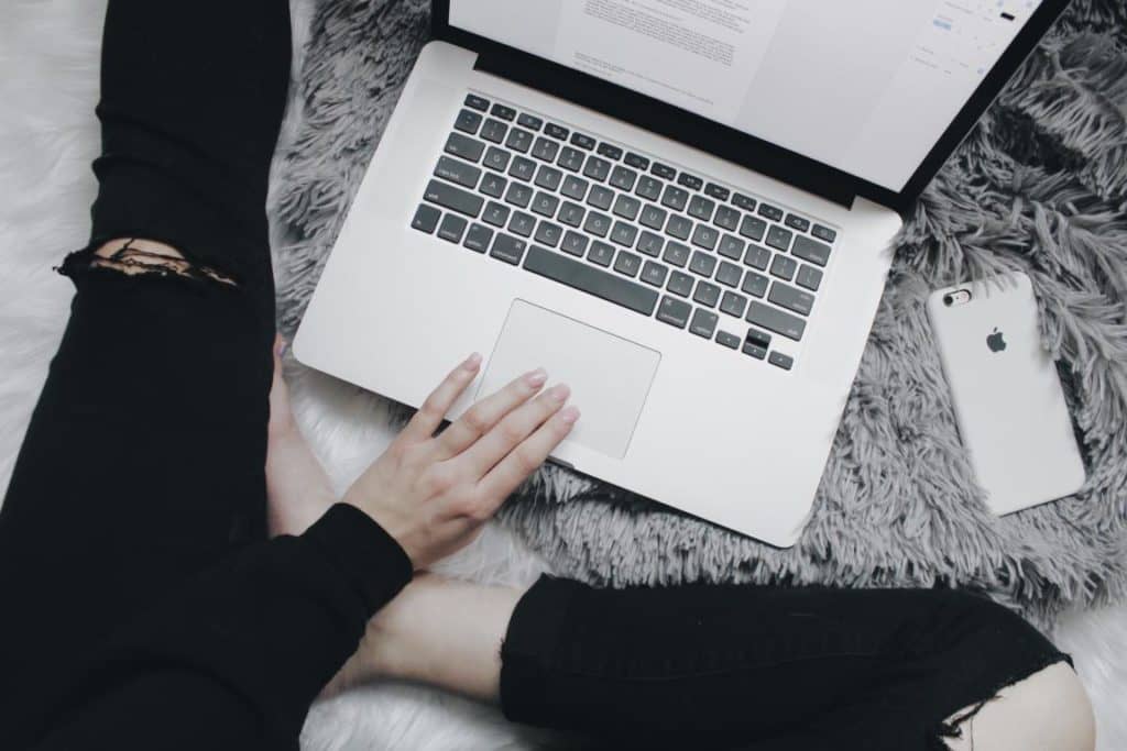 Woman sitting in front of laptop