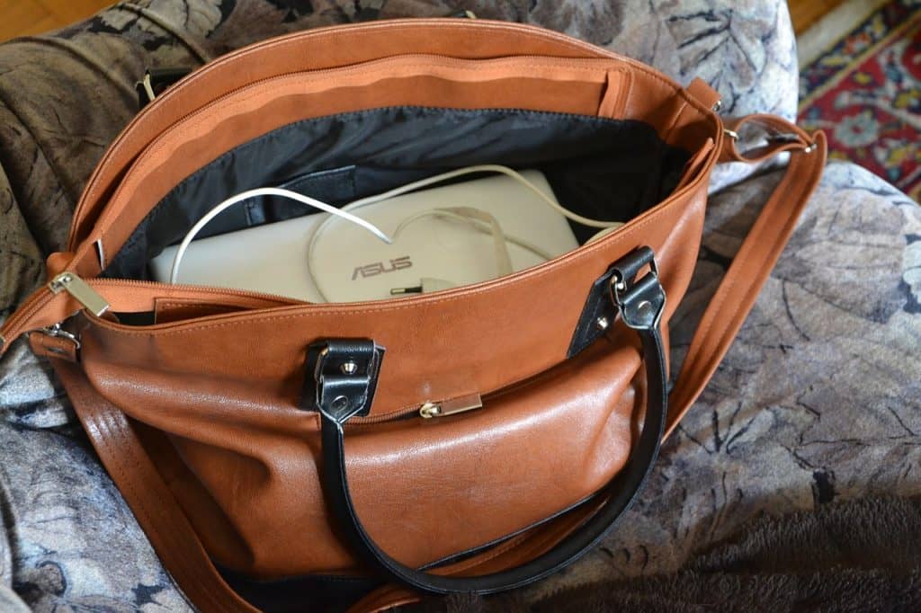 Carry-On Packing List for Digital Nomads Hand Bag with laptop and electronics